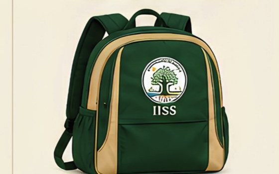 The green and beige IISS school backpack