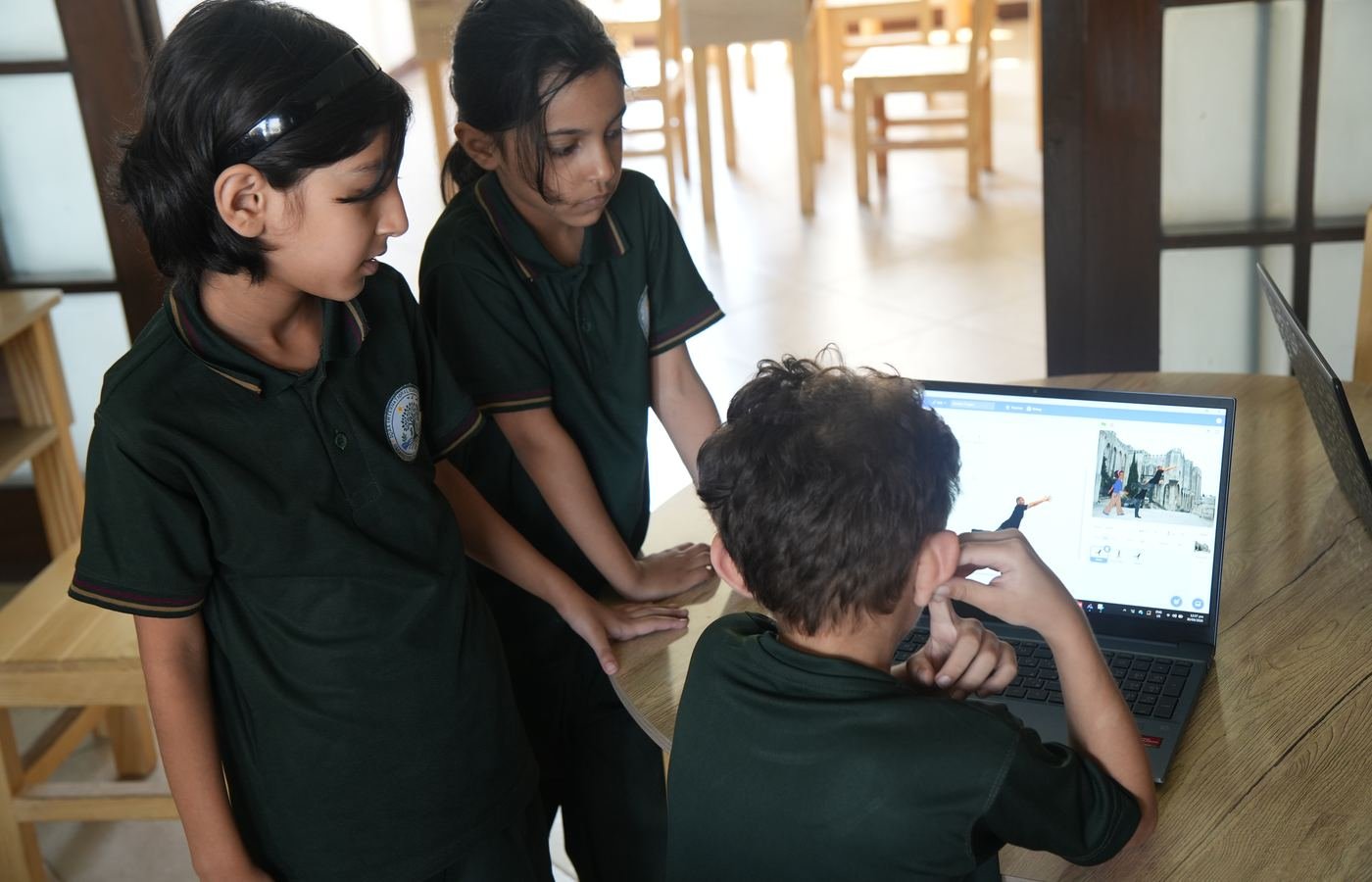 Two pupils working at a computer on a coding lesson