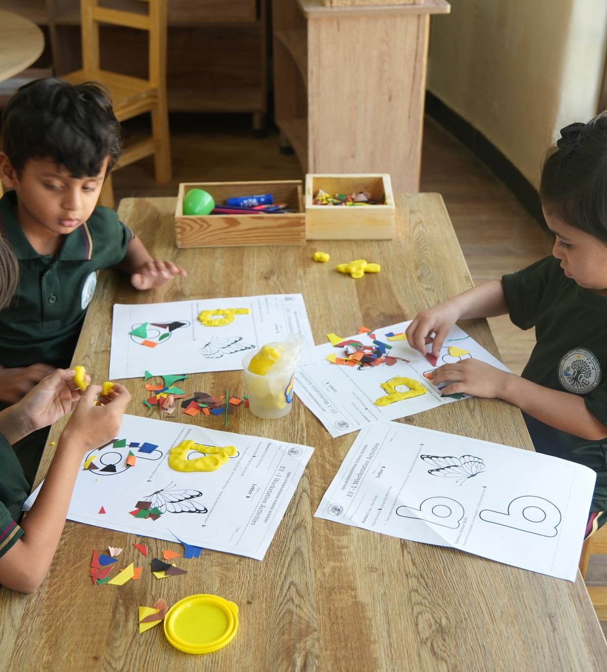 A pupil drawing a rocket at their desk