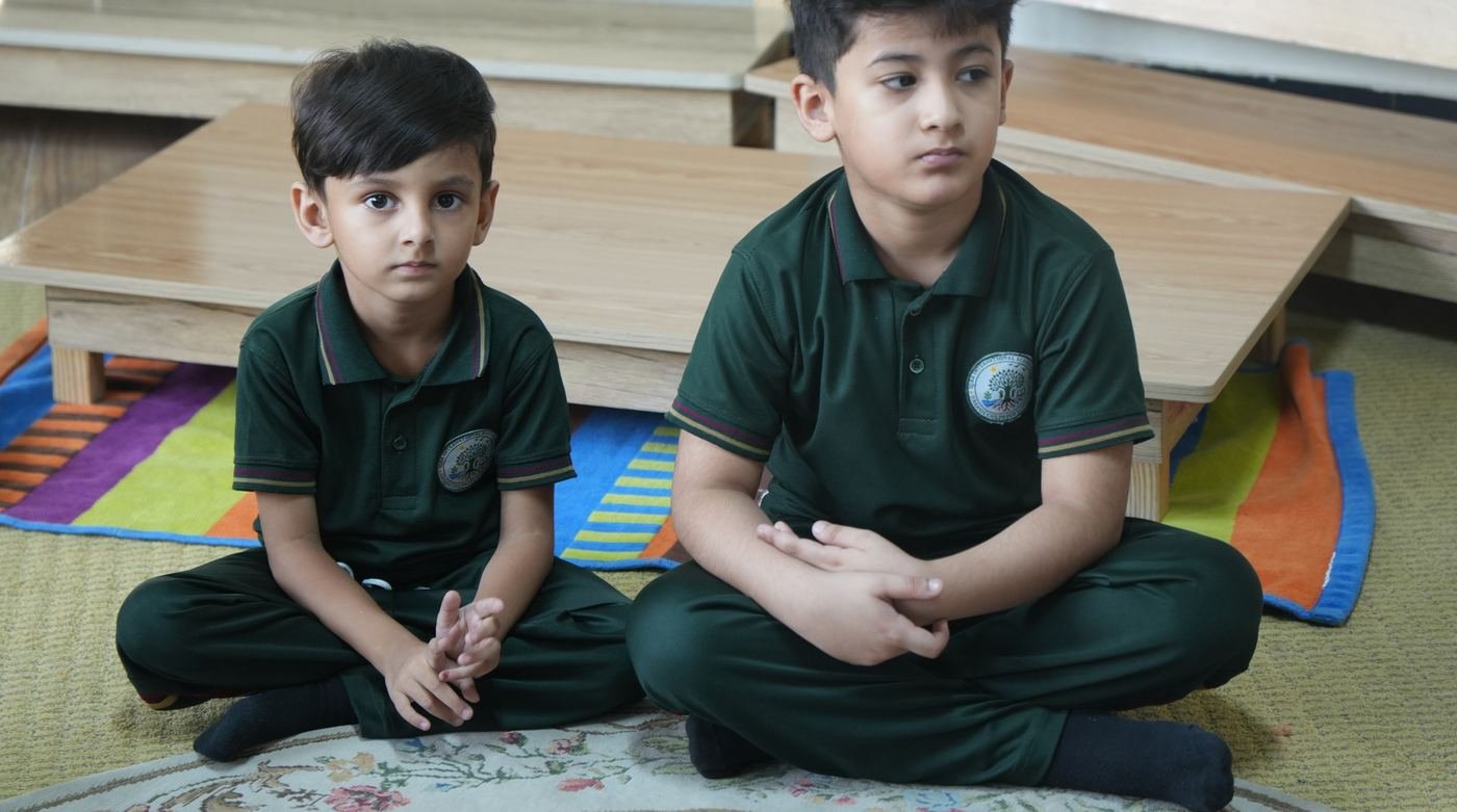 A teacher leading a breathing and mindfulness circle