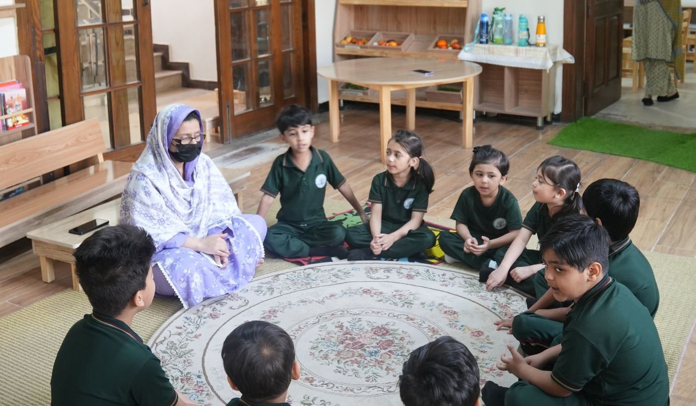 Pupils listening to Quran recitation with headphones